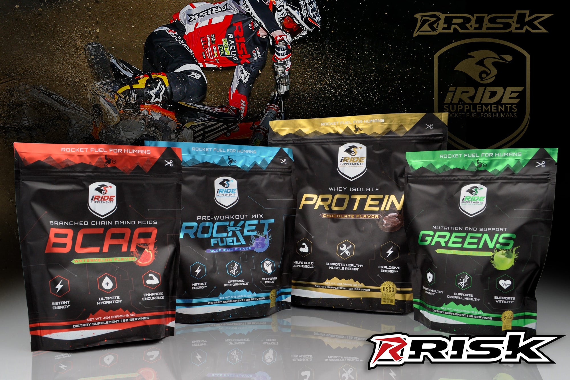 RISK Racing iRide Supplements BCAA's, Rocket Fuel, Protein, and greens laid out next to each other with a motocross rider wearing risk racing red and black motocross gear in the background.
